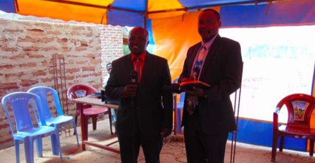 Two men standing preaching God's Word