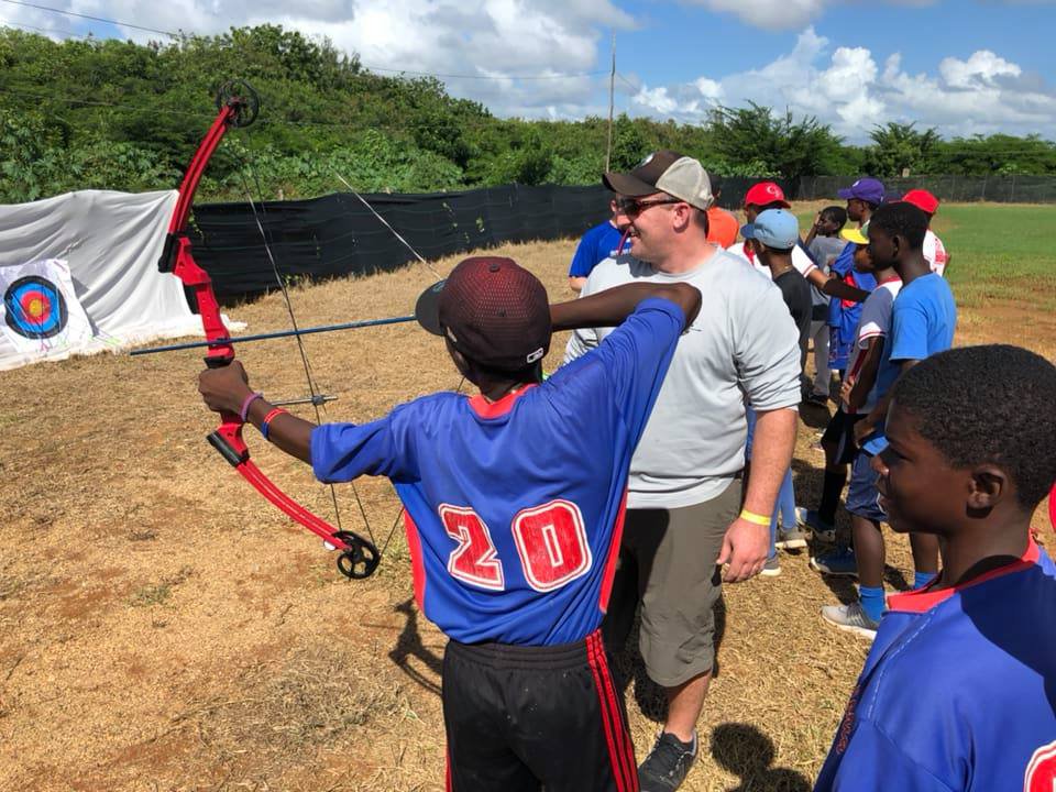 Alex Roupe Camp Director leading Archery Camp in the Dominican Republic